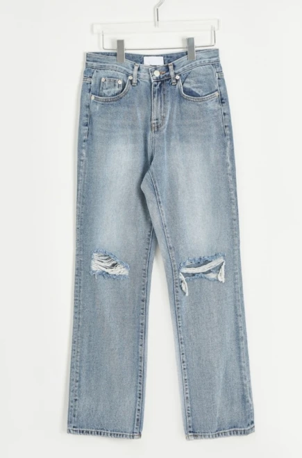 Blue-washed knee destroyed jeans