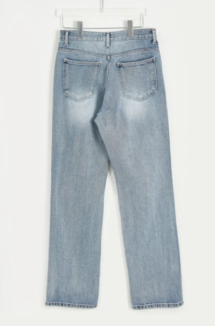 Blue-washed knee destroyed jeans